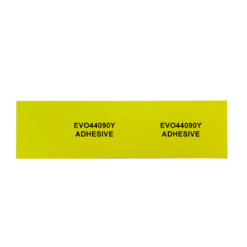 A 90mm x 40mm yellow adhesive PVC tag, suitable for panels and equipment, with “EVO44090Y ADHESIVE” printed twice in black and spaced apart on a plain white background. Product: 90mm x 40mm Yellow Adhesive PVC Tag Suitable For Panels And Equipment (22 tags).