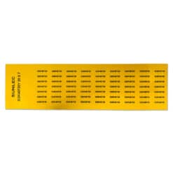 A yellow sheet of SUNLEC 20mm x 7mm adhesive PVC tags (1750 pcs), each printed with S12K40720, for clear panel and equipment identification.
