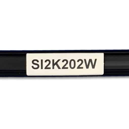 A yellow tag sits inside a black channel. The tag is printed with the characters SI2K203W in black.